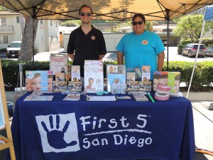First 5 Staff Justin Warner and Tatiana Watkins at the Live It Up! health fair held at the San Diego County Library Vista branch on October 10, 2015.