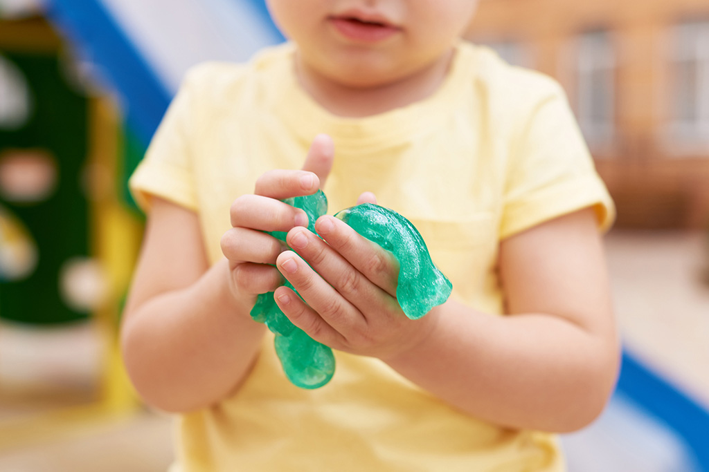 Child playing with DIY slime