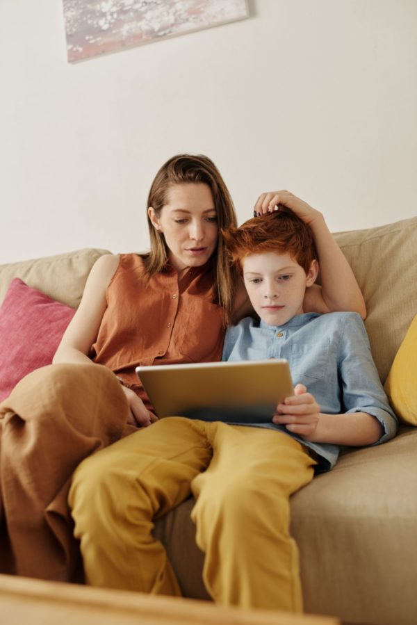 mom and son on tablet computer