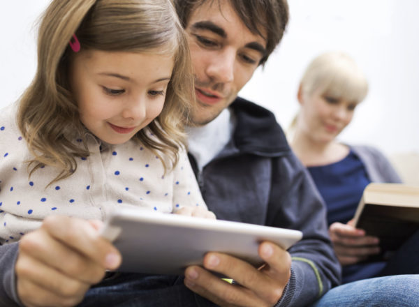 dad and daughter reading a book