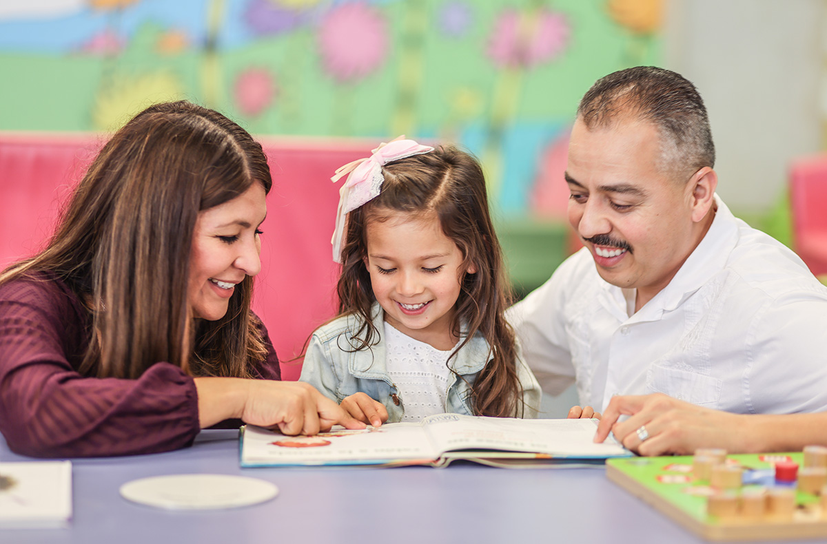 Parents reading to their child